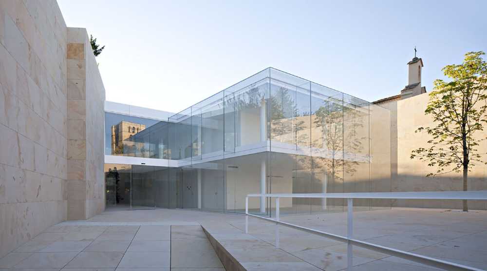 Architecture enclosed within stone and glass. The building